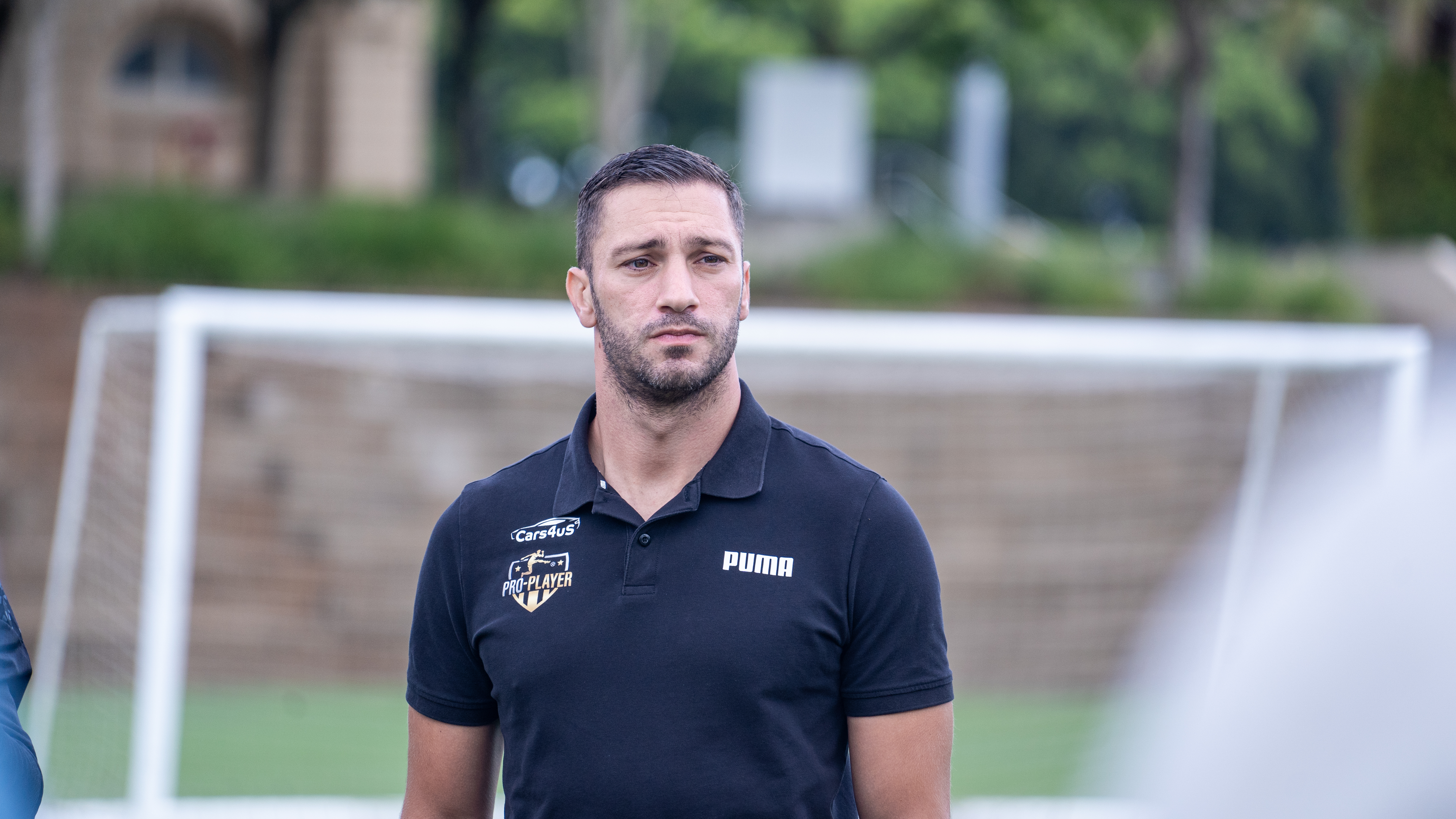 Sam Bartolo analysing tactical positioning pitchside