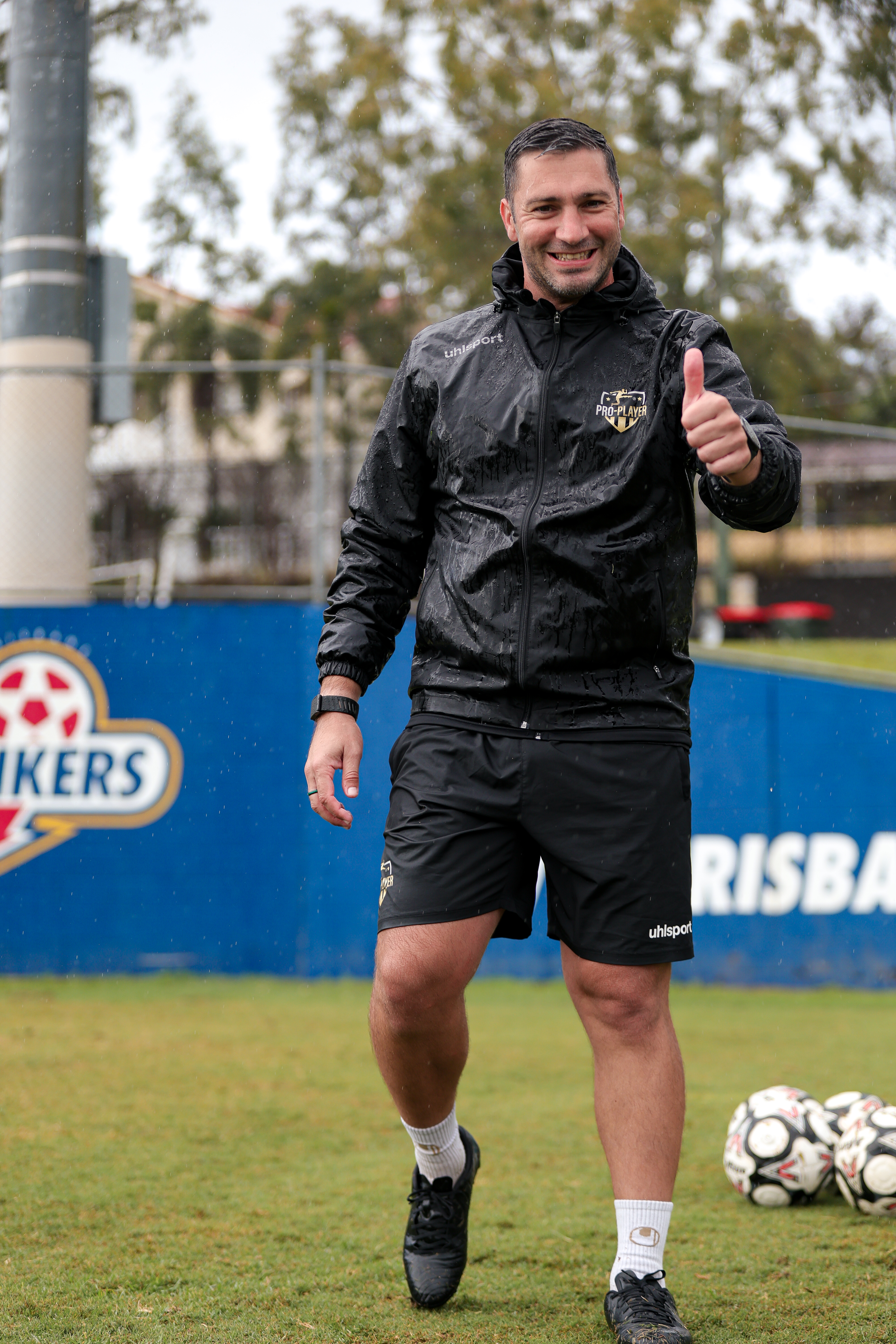 Sam Bartolo holding the 2025 NPL Queensland Premiers Trophies